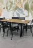 wooden extension table with 6 black chairs